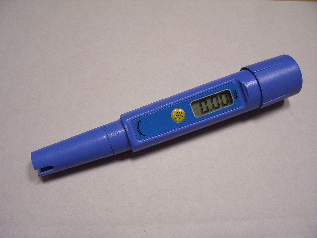 A handheld digital electrical conductivity meter with a probe, used for testing liquids.